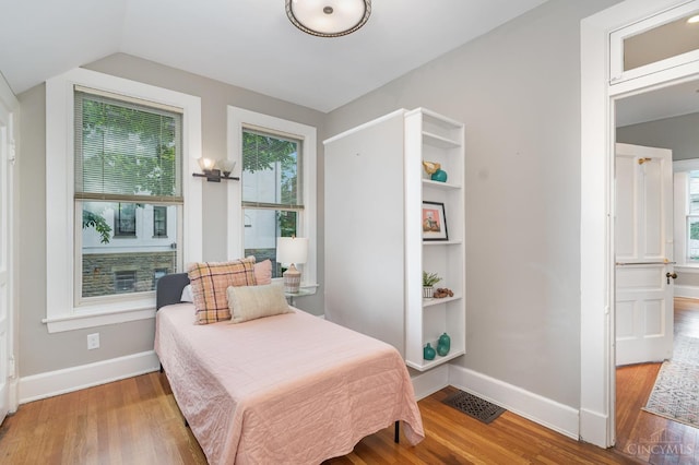 1117 Cypress St, Cincinnati, OH 45206 - bedroom featuring wood finished floors and lofted ceiling