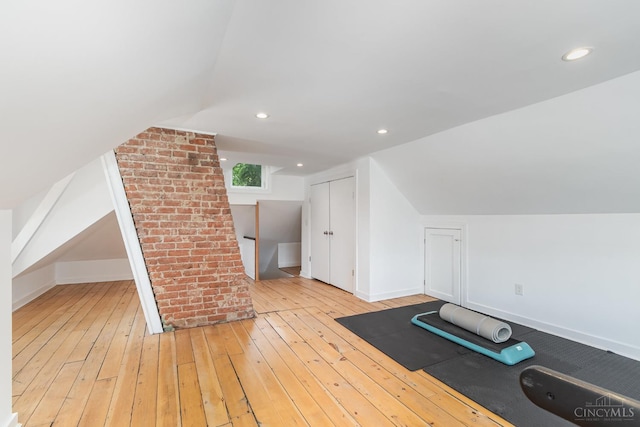 1117 Cypress St, Cincinnati, OH 45206 - exercise room featuring wood-type flooring, vaulted ceiling, and recessed lighting