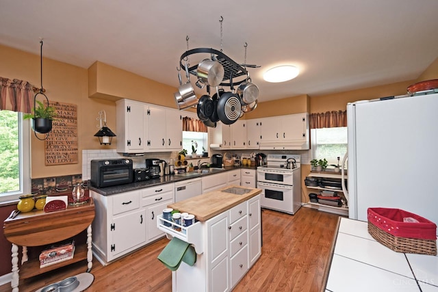 7423 View Place Dr, Springfield Twp, OH 45224 - kitchen featuring white appliances, plenty of natural light, and white cabinetry