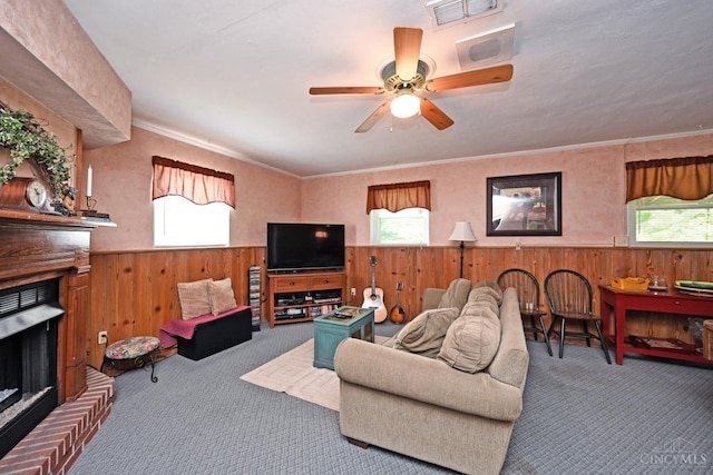 7423 View Place Dr, Springfield Twp, OH 45224 - living room with carpet floors, healthy amount of natural light, wood walls, wainscoting, and a fireplace