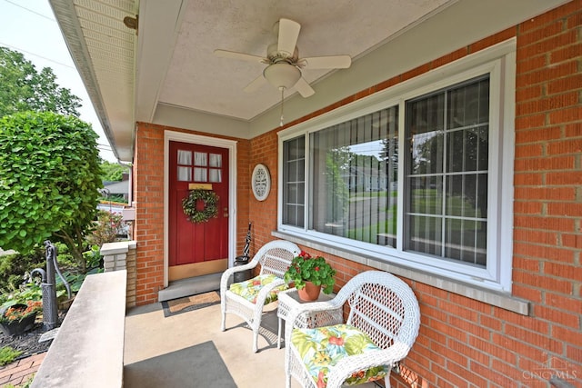 7423 View Place Dr, Springfield Twp, OH 45224 - entrance to property with covered porch, brick siding, and a ceiling fan
