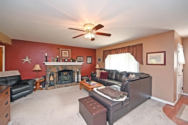 7423 View Place Dr, Springfield Twp, OH 45224 - carpeted living area with ceiling fan and a stone fireplace