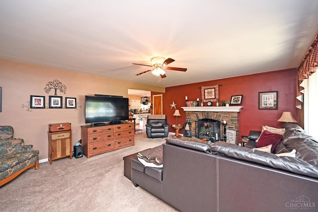 7423 View Place Dr, Springfield Twp, OH 45224 - living room featuring carpet flooring, ceiling fan, and a stone fireplace