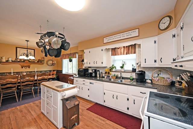 7423 View Place Dr, Springfield Twp, OH 45224 - kitchen featuring white appliances, white cabinetry, dark countertops, and backsplash