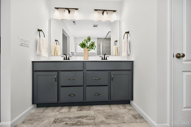 5322 Observer Ct, Turtle Creek Twp, OH 45036 - bathroom featuring double vanity, a shower stall, and marble finish floors