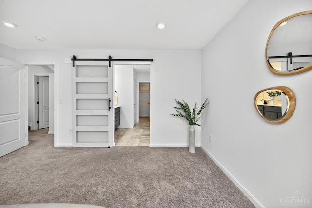 5322 Observer Ct, Turtle Creek Twp, OH 45036 - unfurnished bedroom with a barn door, carpet, and recessed lighting