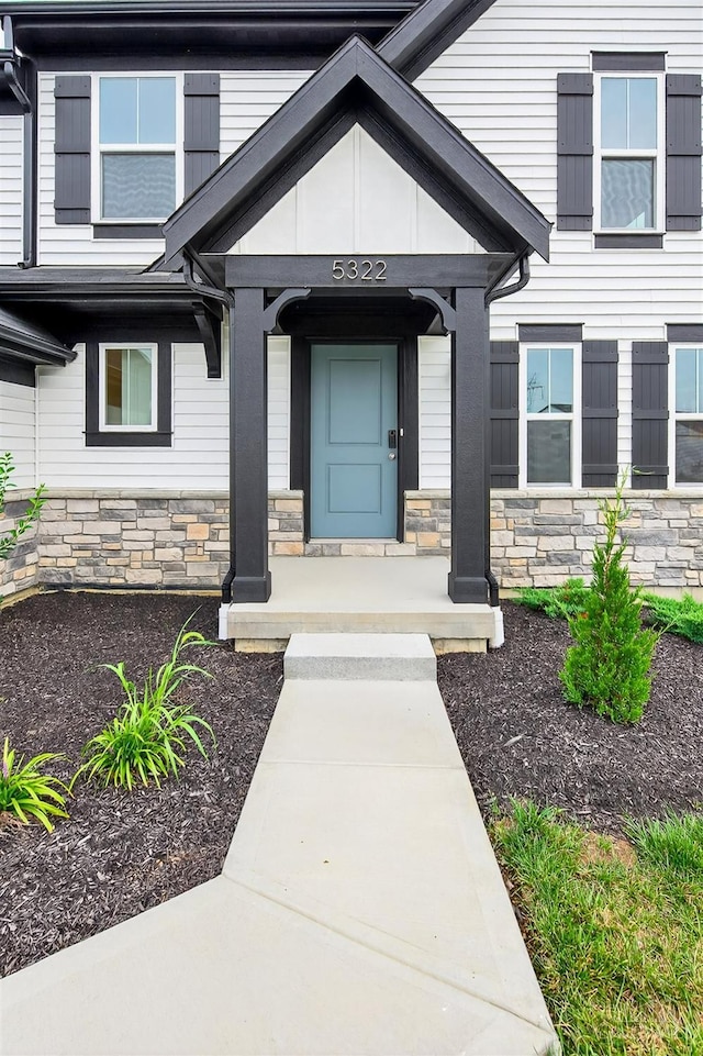 5322 Observer Ct, Turtle Creek Twp, OH 45036 - property entrance featuring stone siding and a porch