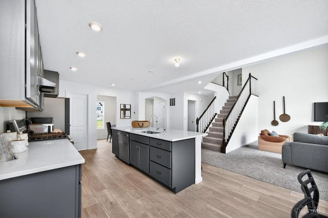 5322 Observer Ct, Turtle Creek Twp, OH 45036 - kitchen with stainless steel appliances, open floor plan, arched walkways, gray cabinets, and a textured ceiling