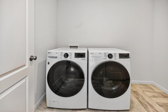 5322 Observer Ct, Turtle Creek Twp, OH 45036 - laundry area featuring washer and dryer and baseboards