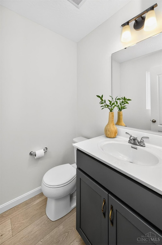 5322 Observer Ct, Turtle Creek Twp, OH 45036 - half bath featuring wood finished floors and vanity