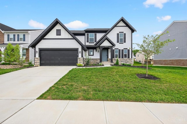 5322 Observer Ct, Turtle Creek Twp, OH 45036 - craftsman inspired home with stone siding, board and batten siding, concrete driveway, a front yard, and an attached garage