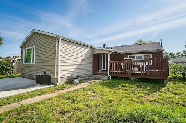 1643 Biscayne Dr, Saint Clair Twp, OH 45013 - back of property with a wooden deck, a lawn, and a patio area