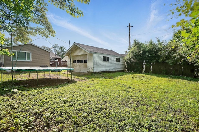 1643 Biscayne Dr, Saint Clair Twp, OH 45013 - view of yard with a trampoline, an outbuilding, and a garage