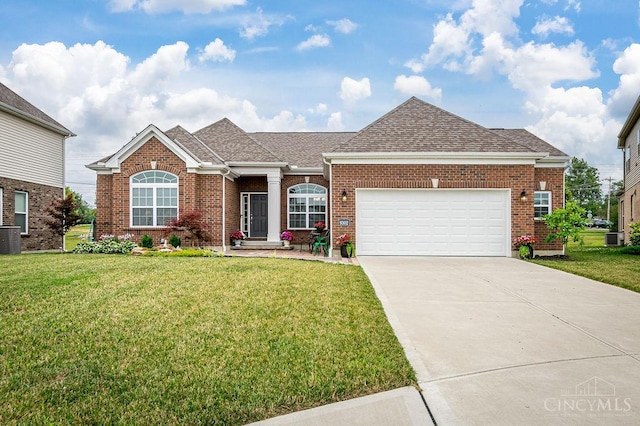 9302 W Meadow Dr, West Chester, OH 45069 - ranch-style house with an attached garage, driveway, and a front lawn