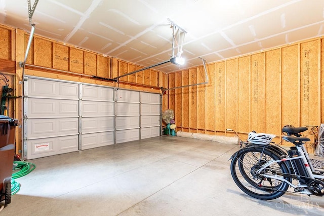 9302 W Meadow Dr, West Chester, OH 45069 - garage featuring a garage door opener