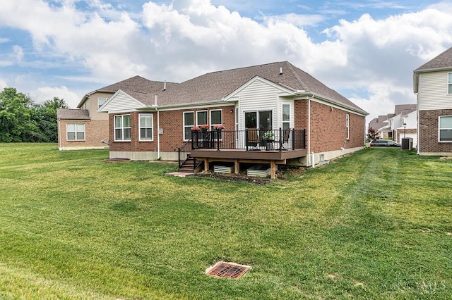 9302 W Meadow Dr, West Chester, OH 45069 - rear view of house featuring brick siding, a deck, a yard, and roof with shingles