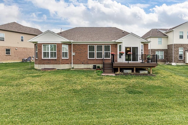 9302 W Meadow Dr, West Chester, OH 45069 - rear view of house with brick siding, a wooden deck, a lawn, and roof with shingles