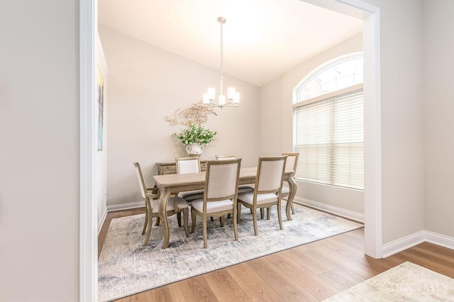 9302 W Meadow Dr, West Chester, OH 45069 - dining space featuring wood finished floors, a chandelier, and vaulted ceiling