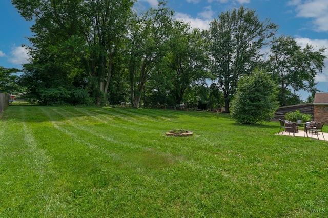 601 Comet Dr, Union Twp, OH 45244 - view of yard with an outdoor fire pit and a patio area