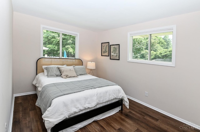 601 Comet Dr, Union Twp, OH 45244 - bedroom with multiple windows and wood finished floors