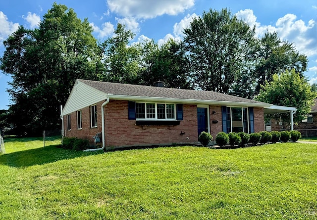 601 Comet Dr, Union Twp, OH 45244 - ranch-style home with brick siding and a front lawn