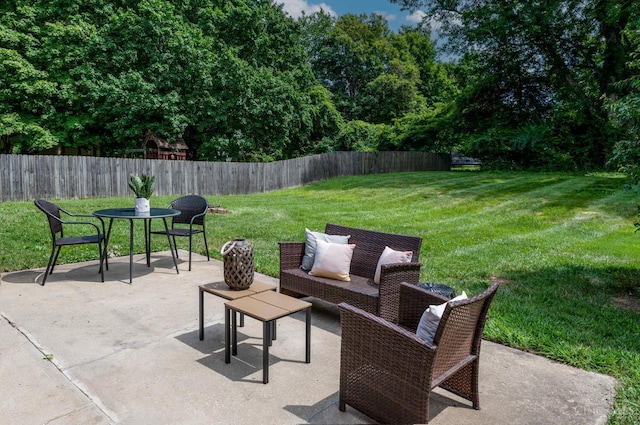 601 Comet Dr, Union Twp, OH 45244 - fenced backyard with a patio area and an outdoor hangout area