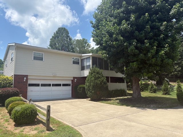 44 Strathmore Blvd, Athens, OH 45701 - view of front of house featuring brick siding, driveway, and an attached garage