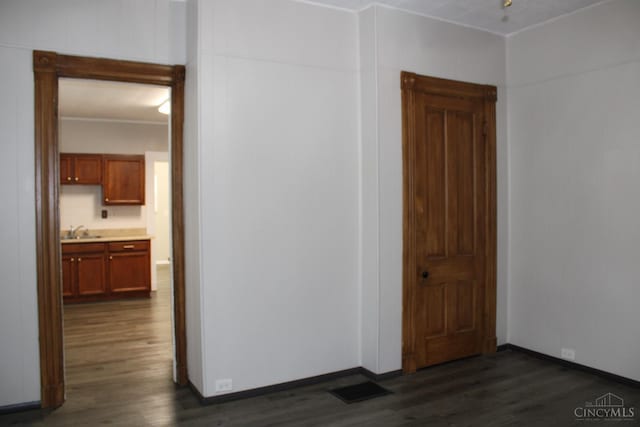 1841 Carll St, Cincinnati, OH 45225 - empty room with dark wood-style floors and ornamental molding