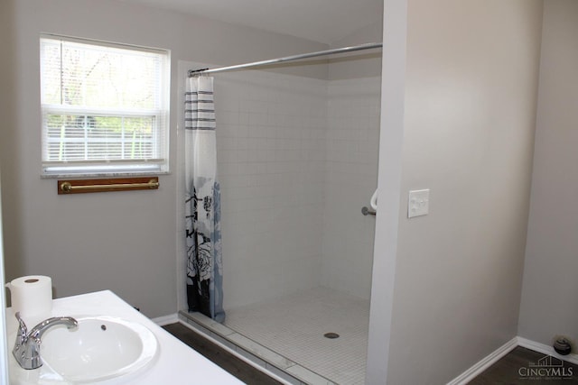 1841 Carll St, Cincinnati, OH 45225 - bathroom featuring a sink and a tile shower