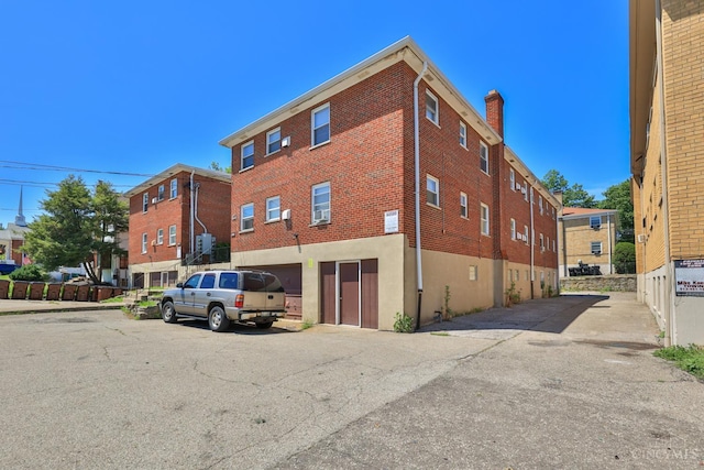 4404 W 8th St, Cincinnati, OH 45238 - view of building exterior featuring an attached garage and driveway