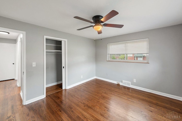 5611 Glengate Ln, Cincinnati, OH 45212 - unfurnished bedroom featuring a closet, dark wood-type flooring, and ceiling fan