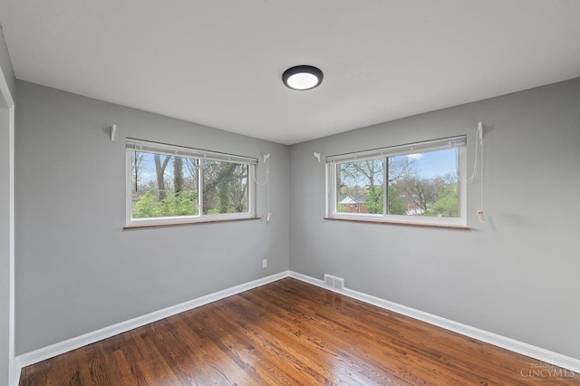5611 Glengate Ln, Cincinnati, OH 45212 - unfurnished room featuring baseboards and dark wood-style flooring