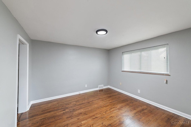 5611 Glengate Ln, Cincinnati, OH 45212 - unfurnished room featuring baseboards and dark wood-style floors