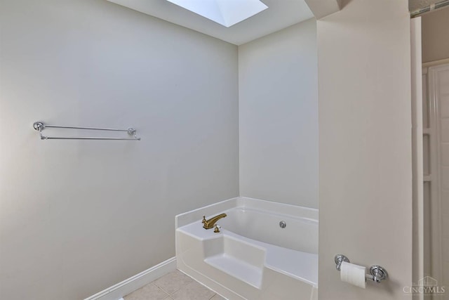 115 Treeline Ct, Harrison, OH 45030 - bathroom with a bath, a skylight, and tile patterned floors