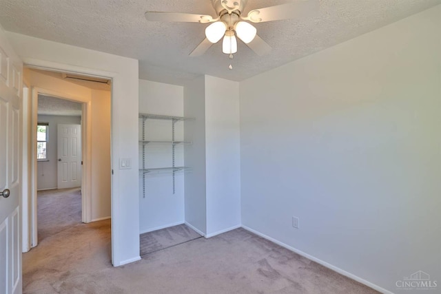 115 Treeline Ct, Harrison, OH 45030 - unfurnished bedroom with light carpet, a textured ceiling, a closet, and ceiling fan