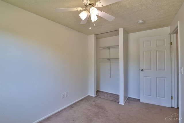 115 Treeline Ct, Harrison, OH 45030 - unfurnished bedroom featuring carpet floors, a closet, a textured ceiling, and ceiling fan