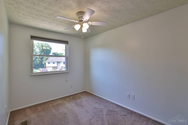 115 Treeline Ct, Harrison, OH 45030 - spare room featuring a textured ceiling, carpet floors, and ceiling fan
