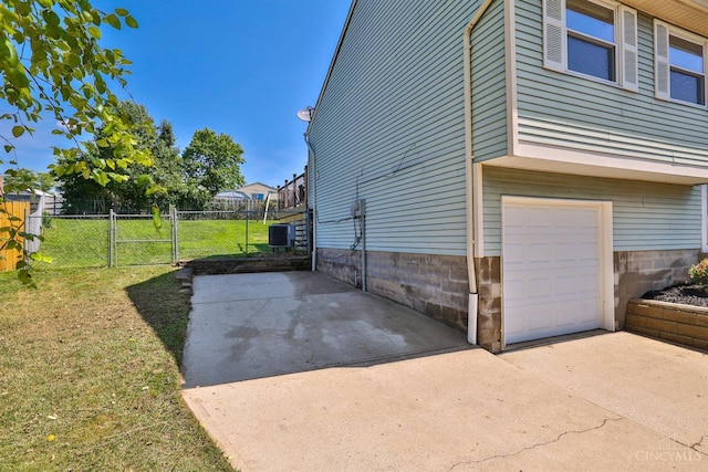 115 Treeline Ct, Harrison, OH 45030 - view of side of home featuring an attached garage and a central AC unit