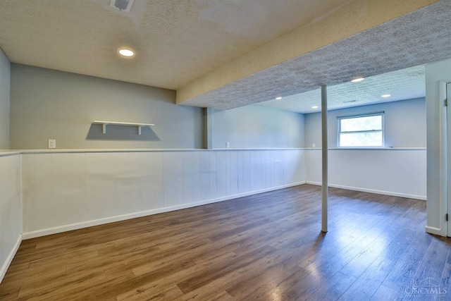 115 Treeline Ct, Harrison, OH 45030 - basement with wood finished floors, wainscoting, a textured ceiling, and recessed lighting