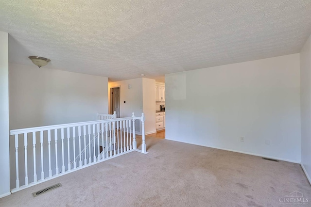 115 Treeline Ct, Harrison, OH 45030 - empty room with light colored carpet and a textured ceiling