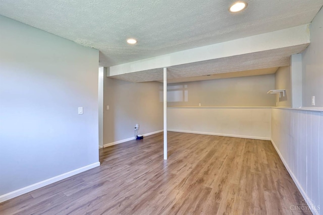 115 Treeline Ct, Harrison, OH 45030 - finished below grade area with wood finished floors, a textured ceiling, and recessed lighting