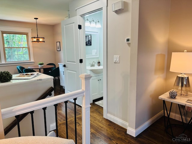 4 Creekwood Sq, Glendale, OH 45246 - hall with dark wood-type flooring and a chandelier