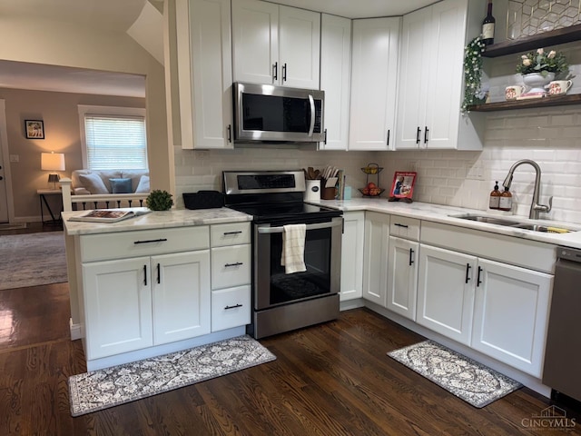 4 Creekwood Sq, Glendale, OH 45246 - kitchen featuring stainless steel appliances, dark wood finished floors, white cabinetry, and backsplash
