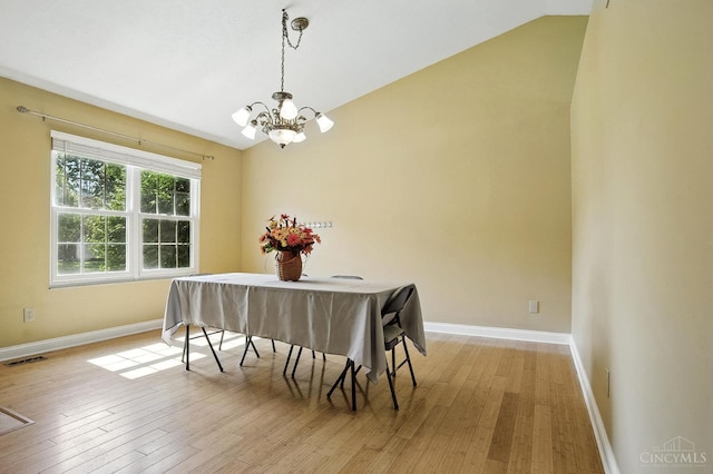 4653 Cardinal Dr, Union Twp, OH 45244 - dining space with a chandelier, lofted ceiling, and light wood-type flooring