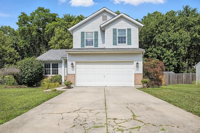 4653 Cardinal Dr, Union Twp, OH 45244 - traditional home featuring brick siding, an attached garage, and concrete driveway