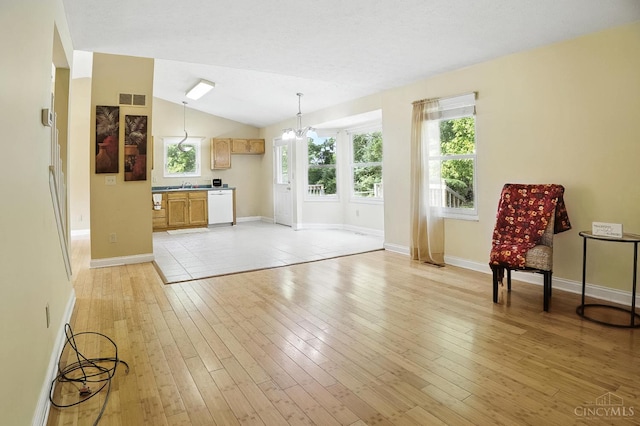 4653 Cardinal Dr, Union Twp, OH 45244 - unfurnished living room featuring light wood-style floors and lofted ceiling