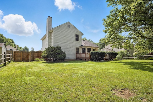 4653 Cardinal Dr, Union Twp, OH 45244 - back of house with a chimney, a fenced backyard, and a deck