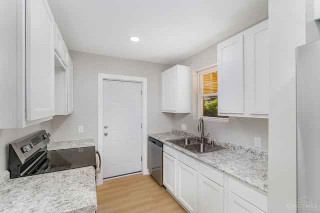 1427 Beaverton Ave, Cincinnati, OH 45237 - kitchen featuring appliances with stainless steel finishes, white cabinetry, light wood-type flooring, and recessed lighting