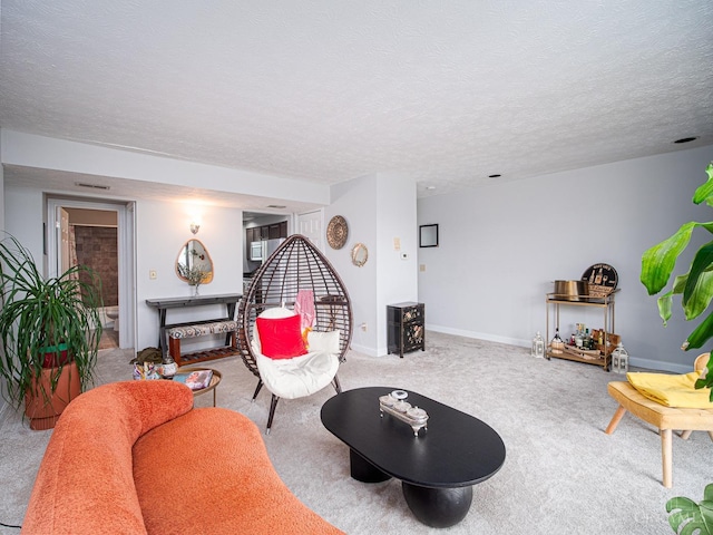 355 Grand Ave Unit 302, Cincinnati, OH 45205 - carpeted living area featuring a textured ceiling and baseboards