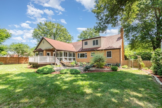 1107 Covedale Ave, Cincinnati, OH 45238 - rear view of house featuring a sunroom, a deck, a fenced backyard, and a chimney